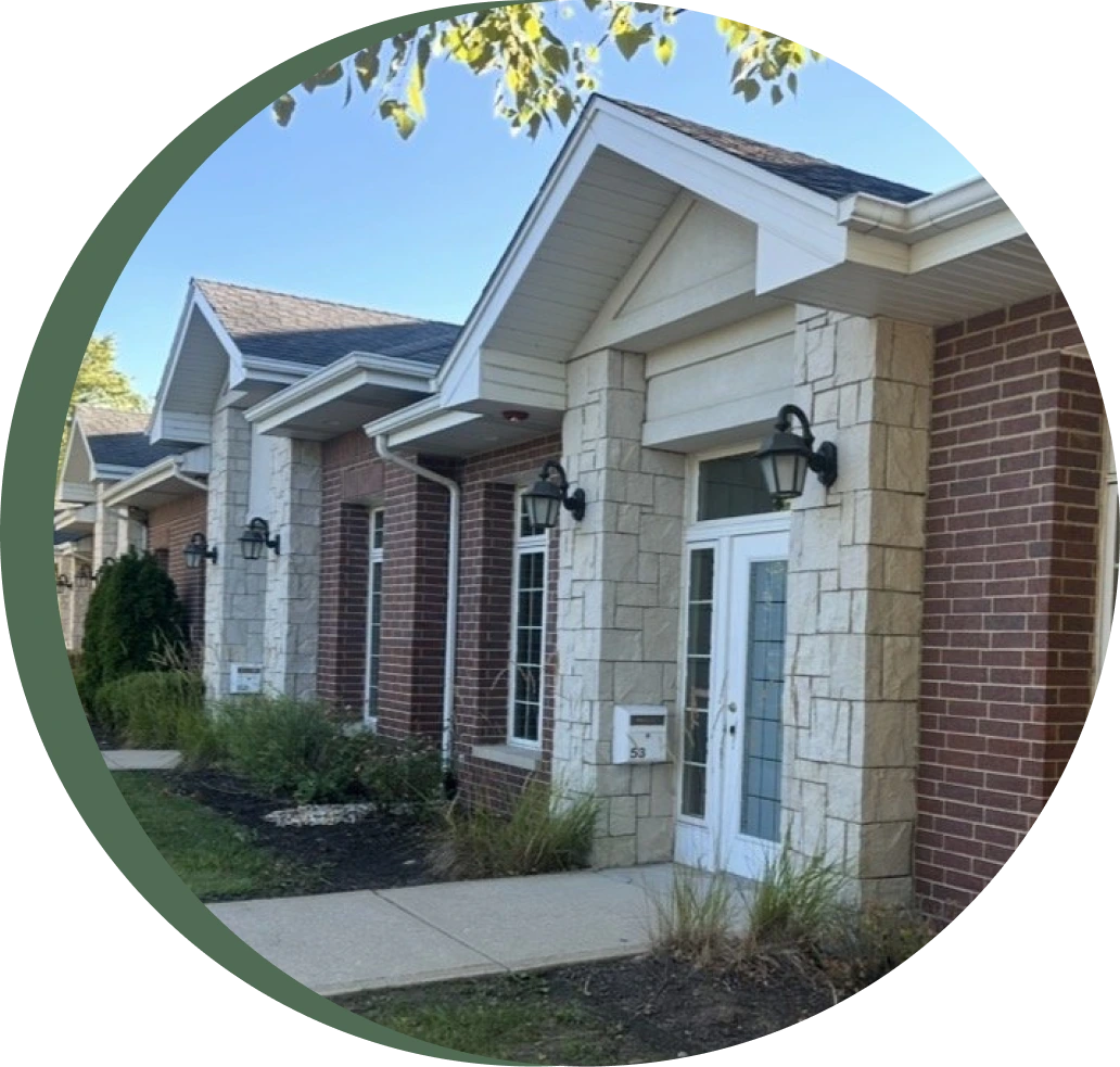 Solstice Collective's Orland Park location exterior with brick and stone façade, white entrance door, and landscaping